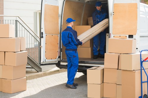 House movers preparing a residential move in Highbury with packed boxes and furniture