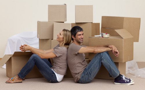 Removal team loading household furniture for a Highbury property move