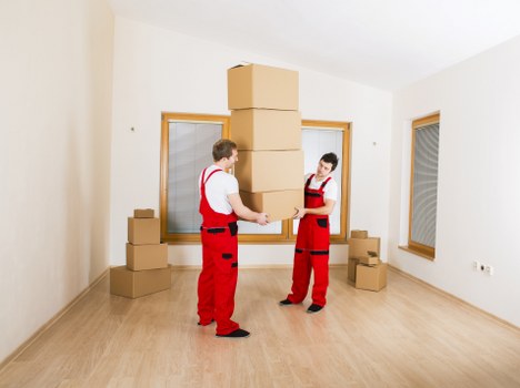 Boxes and household items being loaded into a removals van in Highbury