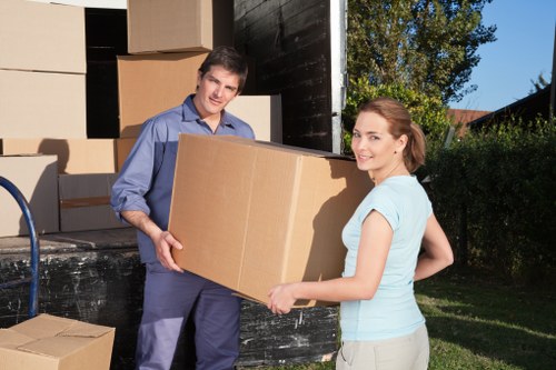 Household boxes and furniture prepared for a removals van service in Highbury
